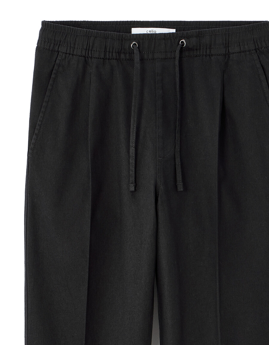 pantalones de algodón y lino elásticos de corte entallado