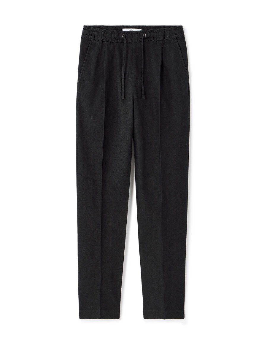 pantalones de algodón y lino elásticos de corte entallado