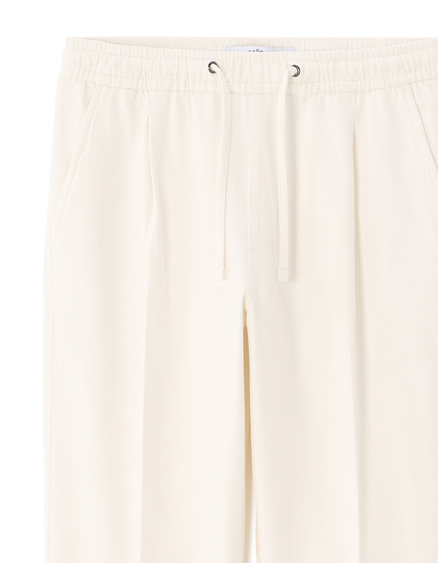 pantalones de algodón y lino elásticos de corte entallado
