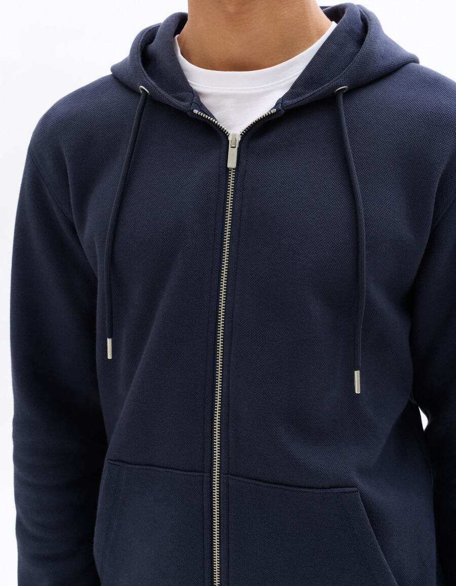 sudadera con capucha de piqué verde de corte regular y cremallera completa